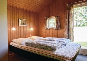 In the midst of beautiful nature on a large plot of land lies this lovely vacation home. in Humble