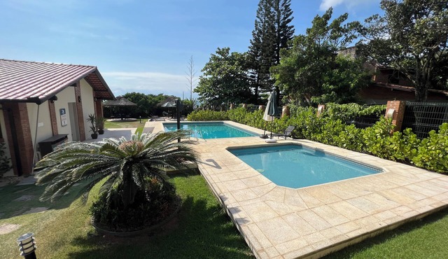 Beachfront house on a paradisiacal beach. in Itapema Balneário Camboriú