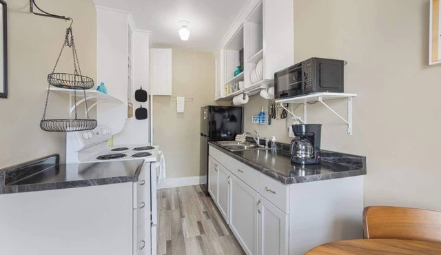 Experience a refined retreat at this elegant apartment situated in the vibrant center of downtown Two Harbors, Minnesota. in Two Harbors