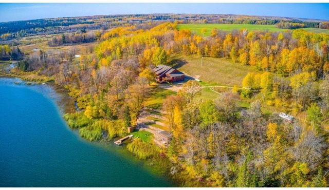 Private, Spacious, 10,000 Sq Ft Custom Built Lake Home w/Lakeside Cabin & 73 ac in Shevlin
