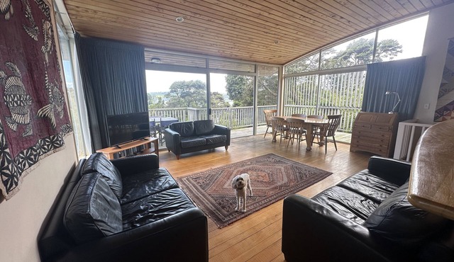 Sunny with decks and bush/harbour views. Three bedrooms. Pet friendly. in Raglan